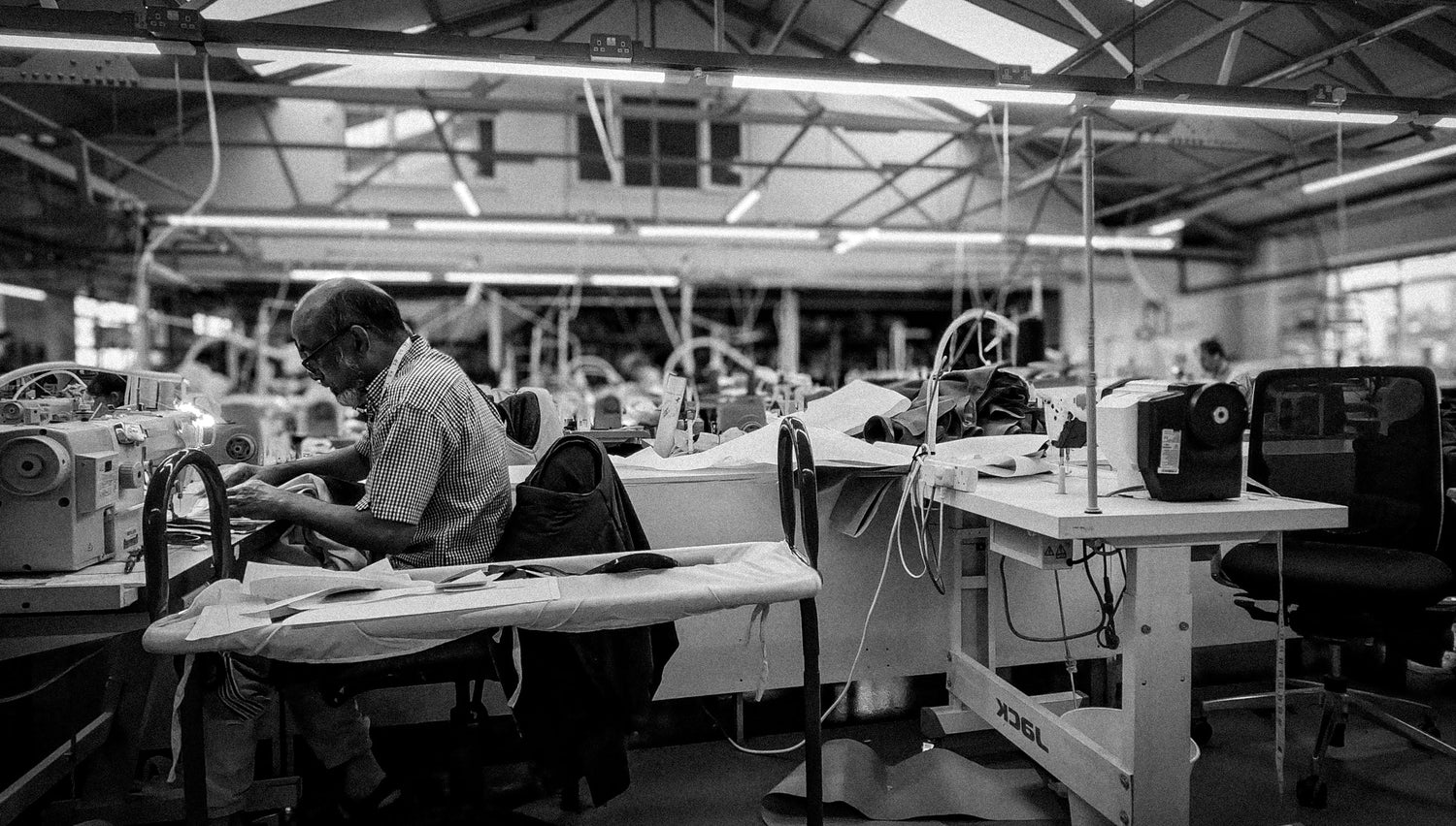 Factory interior with workers at their stations